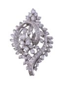 A diamond brooch/pendant,   of swirling design, set throughout with brilliant cut diamonds, pear