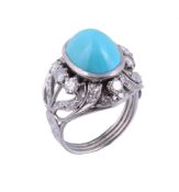 A turquoise and diamond dress ring,   circa 1960, the oval cabochon turquoise within a pierced