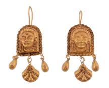 A pair of ancient style ear pendents  , each panel with a relief of a face with granulated