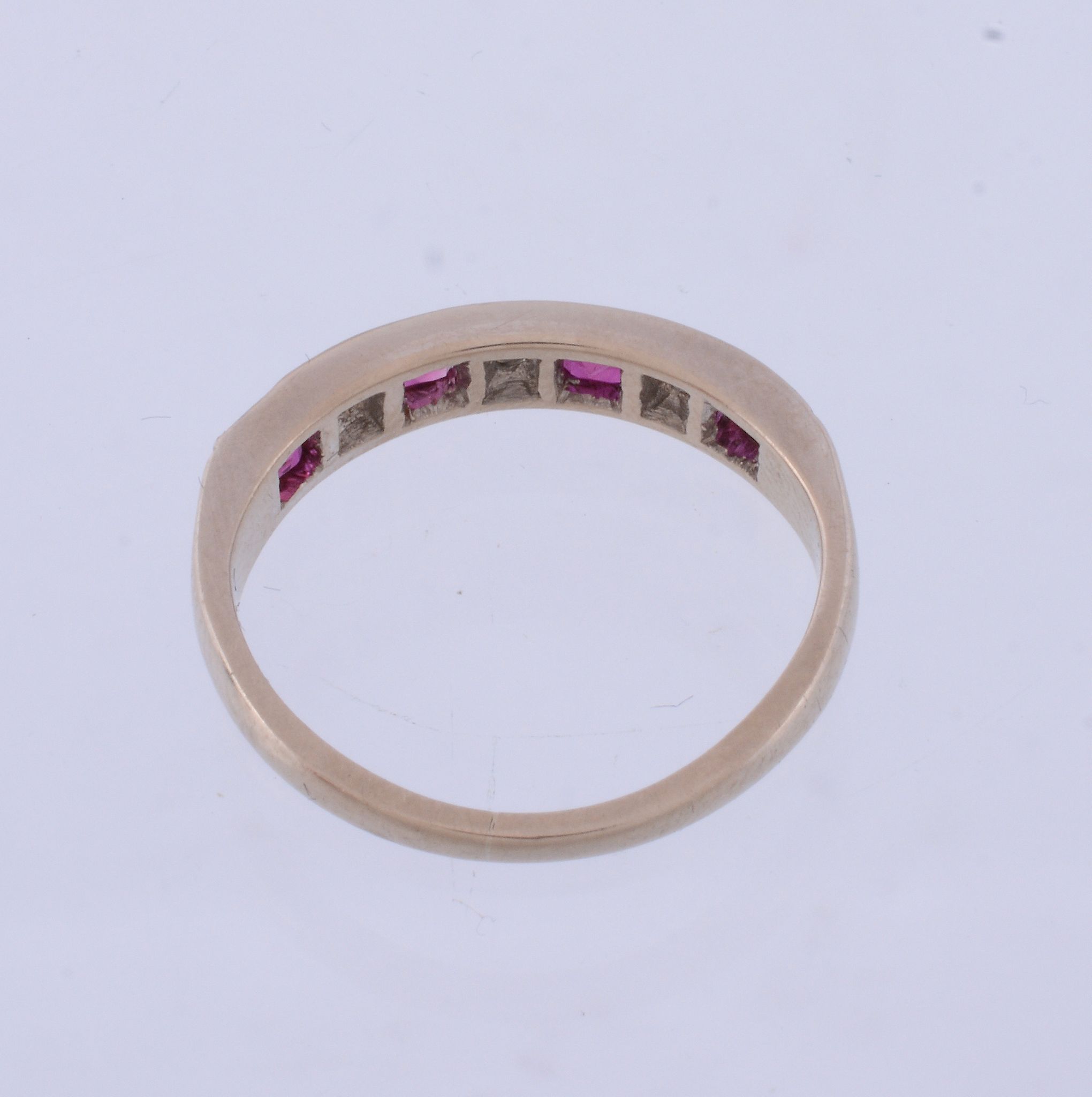 An 18 carat gold ruby and diamond ring,   set with alternating square shaped rubies and brilliant - Image 3 of 3