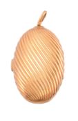 A diamond and gold coloured box,   the oval reeded box with a brilliant cut diamond set thumb