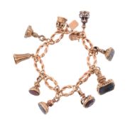 A fob seal charm bracelet,   circa 1880,  the bracelet composed of lovers knot shaped links,
