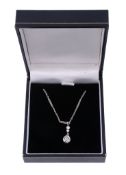A diamond pendant,   the pear shaped old cut diamond in a pinched collet setting, on a fancy link