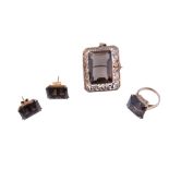 A smokey quartz jewellery suite,   comprising a ring; a pair of earstuds; and a pendant/brooch;