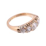 An 18 carat gold five stone diamond ring,   the old brilliant cut diamonds in open claw settings,