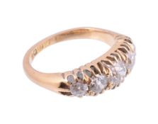 An 18 carat gold five stone diamond ring,   the old brilliant cut diamonds in open claw settings,