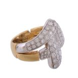 A diamond dress ring,   composed of two intertwining panels set throughout with brilliant cut