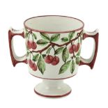 A Wemyss two-handled loving cup, circa 1900, painted with branches on cherries   A Wemyss two-