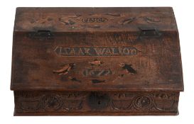 An oak bible box, 17th century and later, the lift top carved with   An oak bible box,   17th