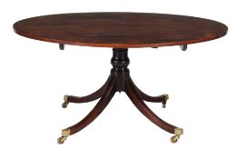 A George III mahogany tilt-top dining table  , circa 1790, the book-matched mahogany top above