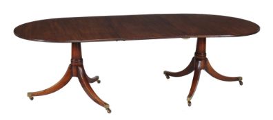A mahogany twin pedestal dining table  , early 19th century and later, the D-ends each above turned