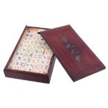 A Chinese export Mahjong set, late 19th or early 20th century, with 152 ivory and bamboo counters