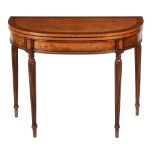 A George III satinwood folding card table  , circa 1790, the cross banded top opening to tooled