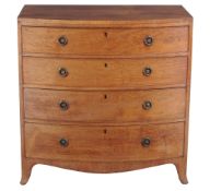 A Regency mahogany chest of drawers  , circa 1815, of bowfront outline, the caddy top above four