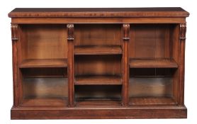 A George IV mahogany open bookcase,   circa 1825, the moulded top above three sections of