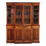 A George III mahogany breakfront library bookcase  , circa 1780, the moulded cornice above four