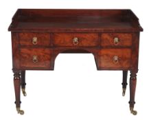 A George IV mahogany dressing table  , circa 1825, the three-quater galleried top above an