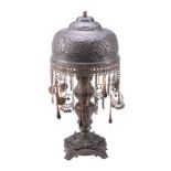 A north African brass standard lamp,   20th century, the domed shade pierced and embossed with