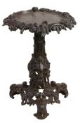A Victorian cast iron grotto table  , circa 1880, the dished top with leaf edge above triform