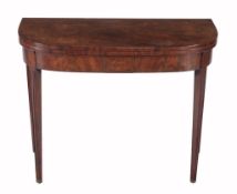 A George III mahogany folding tea table  , circa 1800, the D shaped hinged top above a line inlaid