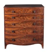 A George IV mahogany bowfront chest of drawers,   circa 1830, the graduated drawers with turned