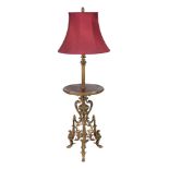 A gilt metal standard lamp  , early 20th century, the reeded and accanthus stem above red marble