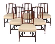 A set of six George III mahogany dining chairs,   circa 1800, in the manner of Sheraton, each