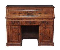 A Victorian burr walnut writing desk  , circa 1860, the rectangular top with canted corners and