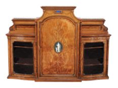A Victorian satinwood and glazed side cabinet,   late 19th century, the central raised top above
