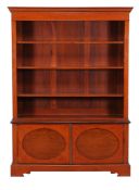 An Edwardian satinwood and crossbanded bookcase  , circa 1900, in the manner of Edwards  &