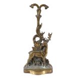 A Victorian brass and iron weighted door porter,   late 19th century, relief cast as a stag