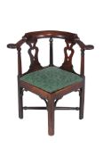 A George II mahogany corner armchair  , circa 1750, the curved arm rail above turned uprights and