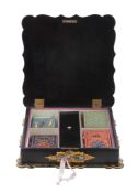 A Victorian painted, parcel gilt and mother-of-pearl inset black papier mache games box,   mid 19th