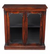 A William IV rosewood side cabinet,   circa 1835, the rectangular top above a pair of glazed doors