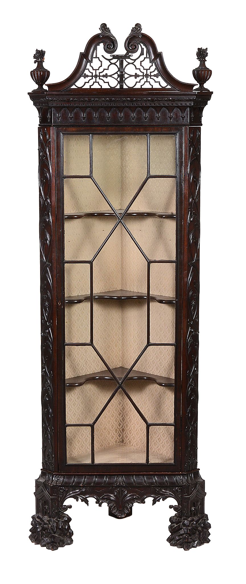 A carved mahogany corner cabinet,   19th century, after the manner of Chippendale, the pierced