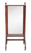 A Regency mahogany cheval mirror  , circa 1815, the rectangular mirror plate within cross-banded