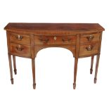 A George III mahogany bowfront sideboard,   circa 1800, the frieze drawer flanked by a cupboard and