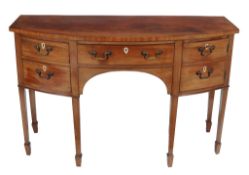 A George III mahogany bowfront sideboard,   circa 1800, the frieze drawer flanked by a cupboard and