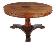 A George IV rosewood drum library table  , circa 1825, the circular top above four short drawers