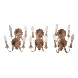 A set of six Italian carved wood twin light wall appliques,   mid 20th century, the elctrical