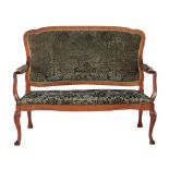 A Continental walnut sofa  , 20th century, the shaped back upholstered in green velvet leading to