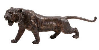 A patinated bronze model of tiger in the late 19th century Meiji style,   20th century, the beast