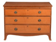 A George III satinwood chest of drawers  , circa 1800, the rectangular cross banded top above