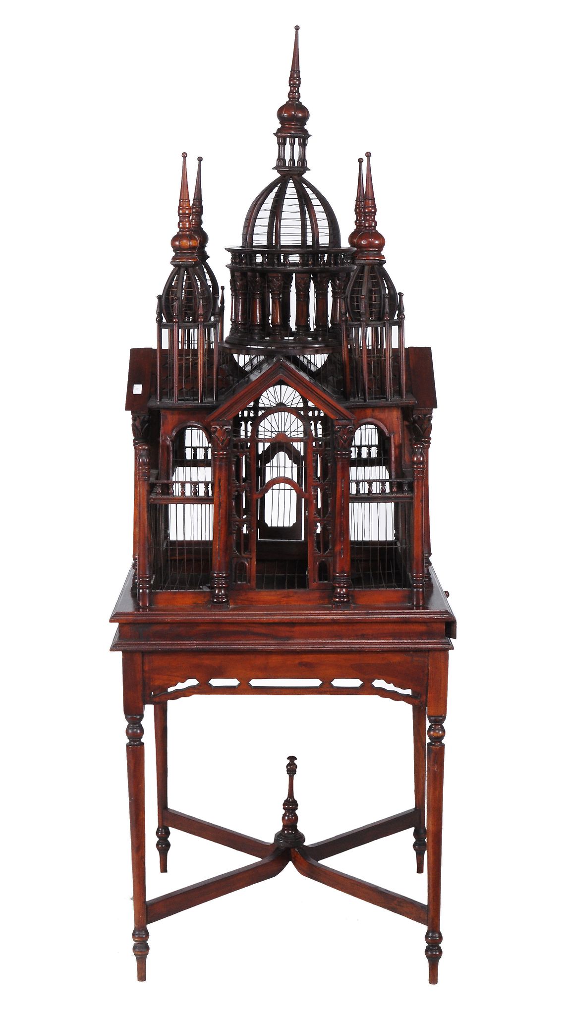 A mahogany birdcage,   20th century, of architectural form, the stand incorporating turned tapered