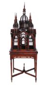 A mahogany birdcage,   20th century, of architectural form, the stand incorporating turned tapered