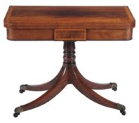 A Regency mahogany card table  , circa 1815, the cross-banded top opening and revolving to baize