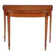 A late George III satinwood and inlaid card table  , circa 1800, the banded top opening to baise