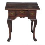 A George III oak side table,   circa 1770, the rectangular plank top above three drawers, shaped