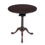 A George II mahogany occasional table  , circa 1750, the circular tilt top above birdcage, turned