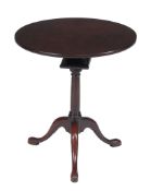 A George II mahogany occasional table  , circa 1750, the circular tilt top above birdcage, turned